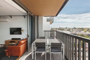 Embrace indoor-outdoor living on the spacious balcony with al fresco dining and scenic views of the CBD and Dandenong Ranges.