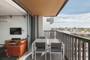 Embrace indoor-outdoor living on the spacious balcony with al fresco dining and scenic views of the CBD and Dandenong Ranges.