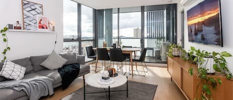 The apartment features a contemporary design with sufficient space for dining at the table or lounging on the couch watching your favourite film.