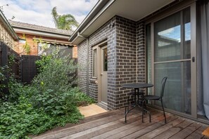 Find another space to unwind and relax in the outdoor deck area that can be found on the ground floor