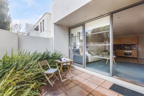 A sunny private patio makes an idyllic spot for your morning coffee or an afternoon wine.
