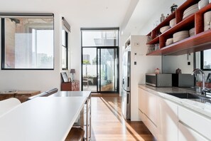 Cook meals in the light-filled, open plan kitchen.