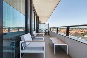 Take a seat out on the balcony, enjoying your morning coffee with a side of city views.
