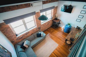 Relax and unwind in the bight open living area with a plush L-shaped lounge situated in front of the HD TV with Netflix.