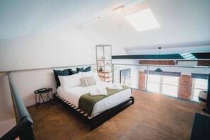 This loft bedroom with attached ensuite is perfect for resetting after a day of exploring the Brisbane CBD