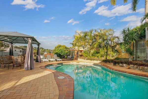 Guests can cool down with a dip in the generously sized pool before relaxing under the shade of the gazebo.
