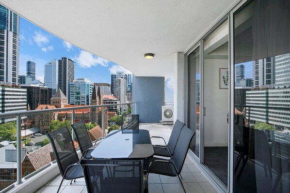 Dine alfresco out on the balcony, while taking in stunning views across the city skyline.