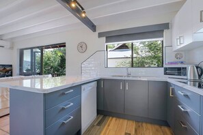 Cook up a storm in the fully-equipped kitchen which includes a fridge, oven, electric stovetop, dishwasher and all the cooking essentials. 
