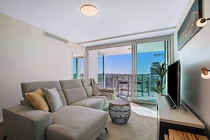  Curling up for a snooze on the couch is perfectly comfortable with a cosy throw blanket and central air conditioning for tempering the room. 
