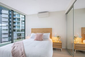 Feel comfortable and at home in the primary bedroom with the large mirrored wardrobe providing ample clothing storage. Rest with ease under air conditioning and a breeze door to the balcony. 
