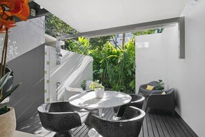 An undercover patio offers ample seating to relax with an evening wine before walking into the city.