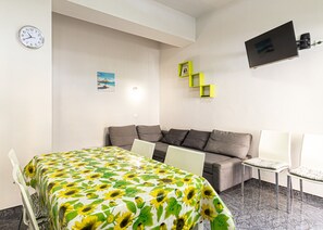 Living room with table-Mandorlo-Elba Island