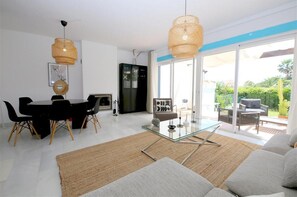 Lounge view from a different angle with dining area for six guests