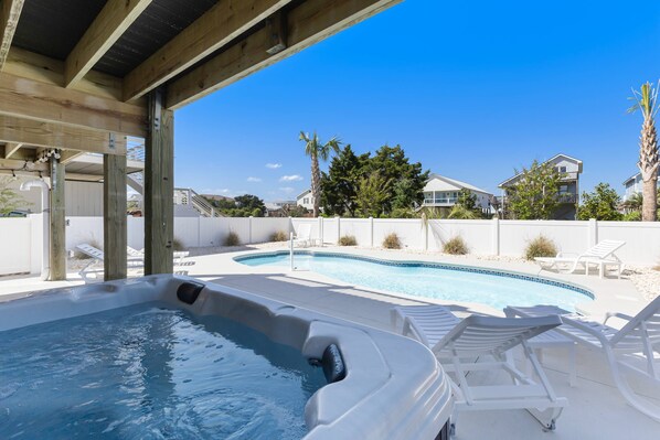 Discover real relaxation as you immerse yourself in the jacuzzi & pool nestled in your backyard paradise.
