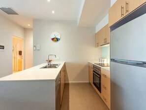 Whip up delicious meals in the open-plan kitchen, perfect for both gourmet cooking and quick snacks.