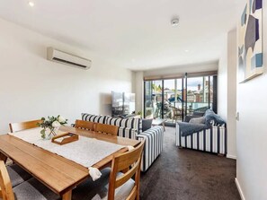 Dine in style in the large adjoining dining area, complete with a six-seat timber table. 