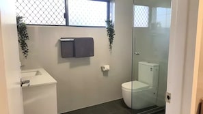 Large new modern bathroom with large shower