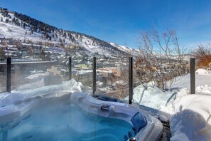 Serene mountain view from your own private hot tub retreat.