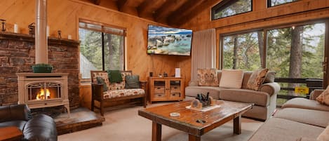 Spacious living space with ample seating, Smart TV, and gas fireplace