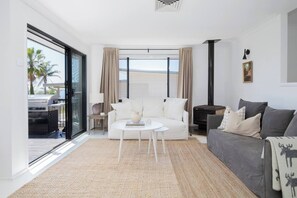 Spread out on the linen sofas, lighting up the indoor fireplace during winter.
