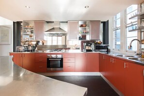 The stainless-steel kitchen offers an inspiring space to whip up your latest creations and is fully-equipped for your holiday catering. 