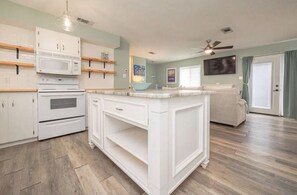 Nice kitchen with big island that opens to living area and dining area