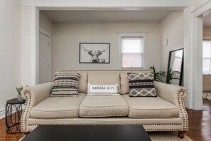 Living room view with cute decor and spacious seating