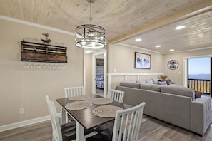 Enjoy dining in style at the table with seating for four, creating a perfect setting for shared meals and camaraderie.