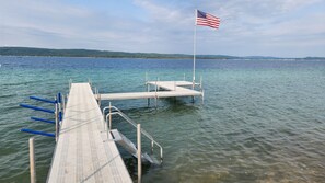 Lakefront has a dock and a mooring buoy - Stairs lead to sandy lake for all your enjoyment