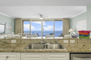 Watch the ocean from the kitchen