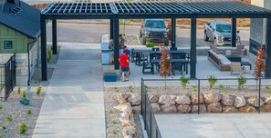 Outdoor seating for all guests at tables or by the gas fireplace.
