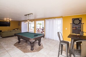 Pool table and dart board.