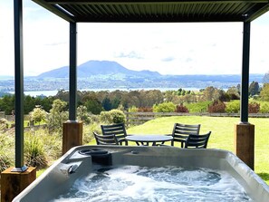 An outdoor spa oasis, offering breathtaking views of Taupo town, Lake Taupo, and the majestic Mt. Tauhara. Equally mesmerising at night, with the town's dazzling lights.