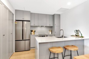 Experience culinary delights in the modern and well-equipped kitchen, perfect for both seasoned chefs and aspiring home cooks.