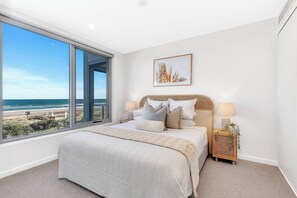 Retreat to the spacious primary bedroom, adorned with a king bed, offering mesmerising ocean views and ensuite bathroom.