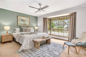 The generous master suite benefits from a king-sized bed and private ensuite bathroom.
