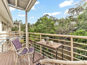 Unwind on the balcony with peaceful garden views.