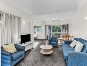 Unwind on the sofa and enjoy your favorite shows in this bright, open space.