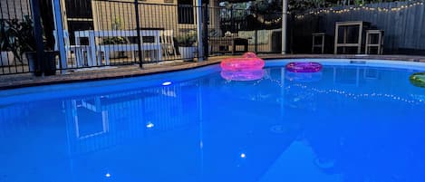 Swimming pool lights, fairy lights , outdoor seating and BBQ make for magic