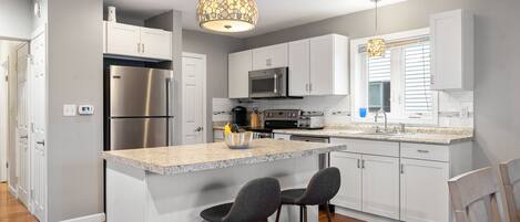 In this cozy kitchen, simplicity meets style with a classic white subway tile