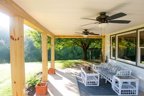 Front porch overlooking the pond. Ceiling fans are perfect for summer nights. 