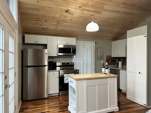 The island features open cabinet space to store your food items 