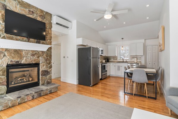 This bright and inviting open kitchen showcases a clean and modern aesthetic