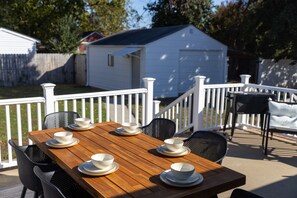 Outside dining area in the balcony deck with bbq grill