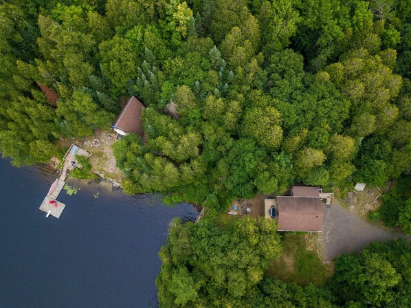 Aerial view of main cottage (right) and A-frame (left).