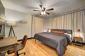 Master with king bed, end tables, reading lamps, walk-in closet, 55-inch 4K TV.