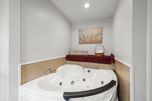 Relax and rejuvenate in the elegant master bedroom's jetted bathtub after a day in Houston weather!