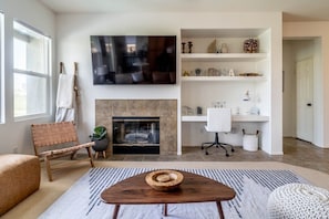 Fireplace and 70" Smart HD TV.