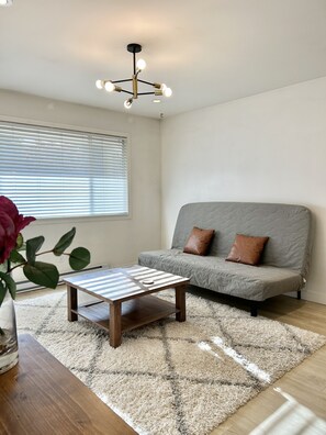 Living room with foldable futon (queen size)