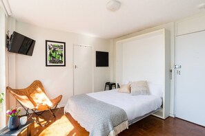 Sleep easy on the plush queen bed made with hotel quality linen. 